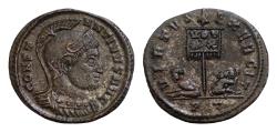 Ancient Coins - CONSTANTINE I THE GREAT (307-337). AE19mm 3,4g Follis. Ticinum. CONSTANTINVS AVG . Silvered Helmeted and cuirassed bust right.VIRTVS EXERCIT / PT. Vexillum