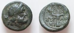 Ancient Coins - Sicily, Syracuse Æ 13mm. 2,5g.  Time of the Fifth Democracy, 214-212 BC. Diademed head of Poseidon to right / Ornate trident head flanked by two dolphins swimming downward