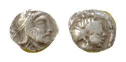 Ancient Coins - CILICIA, Uncertain. Circa 4th century BC. AR Obol (0.5 gm). Female head right, wearing earring and necklace, hair bound in sakkos / Head of satrap right, wearing Persian headdress.