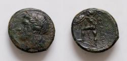 Ancient Coins - Sicily, Messana. 310-288 BC. Æ Litra (23mm, 6.61g). Wreathed head of Pelorias l., wearing single-pendant earring and necklace; two dolphins before. R/ Nude warrior (Pheraimon?)