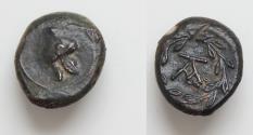 Ancient Coins - SICILY, Tauromenion. Campanian mercenaries. 354/3-344 BC. Æ Onkia 12mm, 1,9g, . Campanian helmet ornamented with griffin / Monogram within laurel wreath.