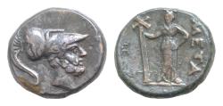 Ancient Coins - Lucania, Metapontion Æ 16mm. 4,9g  Circa 250-207 BC. Helmeted head of Leukippos to right / Demeter standing facing, head to right, holding long-cross torch; META to right