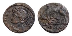 Ancient Coins - City Commemorative Æ 16mm. 2,3g  Struck under Constantine I. Lugdunum, AD 330-331. VRBS ROMA, helmeted Roma to left, wearing imperial mantle She-wolf suckling Romulus and Remus