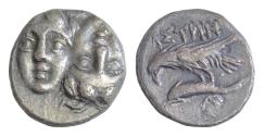 Ancient Coins - MOESIA, Istros. Circa 4th Century BC. AR 18mm Drachm (5,64gm). Facing male heads, the right inverted / Sea-eagle left, grasping dolphin with talons Toned Good Very Fine