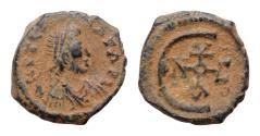 Ancient Coins - Justinian I. 527-565. Æ Pentanummium (13,5mm, 2,2g,). Theoupolis (Antioch) mint. Struck 560-565. Diademed, draped, and cuirassed bust right / Monogram.