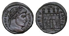 Ancient Coins - CONSTANTINE I THE GREAT (306-337). Follis. Arles. CONSTANTINVS AVG. Laureate head right. VIRTVS AVGG / SA (crescent) RL. Camp gate, with wide open doors, four turrets; star above.