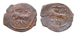 World Coins - ISLAMIC. Uncertain. AE15mm 0,4g (Circa 11th-14th centuries). Obv: Lion left. Rev: Lion right