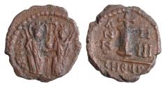 Ancient Coins - Justin II. 565-578. Æ Decanummium (19mm, 3.2 g). Theoupolis (Antioch) mint. Dated RY 5 (569/70). Justin and Sophia enthroned facing, holding cross on globe between them / Large I;