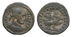 Ancient Coins - Licinius I (308-324). Æ Follis (19mm, 3g,). Arelate, 319. Laureate and cuirassed bust r. R/ Licinius, holding sceptre and thunderbolt, reclining on back of eagle standing r.;