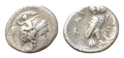Ancient Coins - Tarentum, Calabria. AR Drachm (15 mm, 3.g), c. 302-280 BC. Head of Athena right, wearing crested helmet decorated with Skylla hurling rock.  Owl