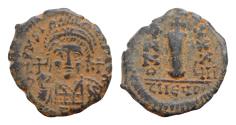 Ancient Coins - Justinian I. 527-565. Æ decanummium 20 mm, 4.2g,  Antioch mint, FYI Year 37,. D N IVSTINIANVS PP AVG, helmeted and cuirassed bust facing, holding globus cruciger and shield