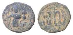 World Coins - ISLAMIC. Arab-Byzantine (Circa 685-692). Fals. Uncertain  Crowned and draped imperial bust facing, holding globus cruciger.  Large M. Very fine. 2,8g. Diameter: 19-20 mm.