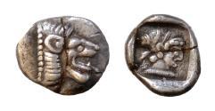 Ancient Coins - Caria, Knidos AR hemiobol (Silver, 0.43g, 8mm) ca 490-465 BC. Head of roaring male lion right Head of Aphrodite right of heavily archaized style, hair in saccos, all within incuse