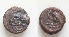 Ancient Coins - SICILY, Kamarina. Circa 420-410 BC. Æ14mm  Tetras (3,65gm). Gorgoneion / KAM, Owl standing left, grasping lizard; three pellets in exergue.