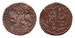 World Coins - ISLAMIC. Uncertain. AE18mm 1,4g (Circa 11th-14th centuries). Obv: Lion left.