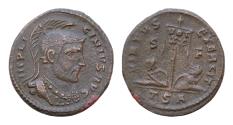 Ancient Coins - LICINIUS I, (A.D. 308-324), AE18mm 2,4g  issued 319, Thessalonica. Licinius laureate helmeted bust right standard inscribed VOT XX, captives seated at base,
