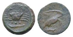 Ancient Coins - Sicily. Akragas 425-410 BC. Tetras Æ 22mm., 7,5g. Eagle standing right on, and tearing at, hare / Crab; below, three pellets (mark of value) above fish. Good very fine