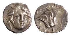 Ancient Coins - Greek Islands off Caria. Rhodos circa 205-190 BC. Ainetor, magistrate Drachm AR 15 mm, 2,46g Head of Helios facing slightly to right /  Rose