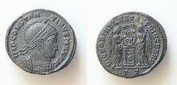 Ancient Coins - Constantine I (307/310-337). Æ Follis (18mm, 2.55g,). Ticinum, 318-9. Laureate, helmeted and cuirassed bust r. R/ Two Victories