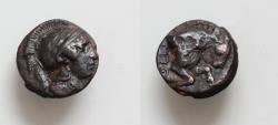 Ancient Coins - LUCANIA, Thourioi. Circa 435-410/05 BC. Æ (12,5mm, 1.7g, ). Helmeted head of Athena right / Forepart of bull butting right.