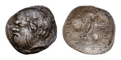 Ancient Coins - SICILY, Katane. Circa 450-425 BC. AR 12mm Litra (0.6 gm). Wreathed head of Silenos left / Winged thunderbolt flanked by round shields