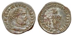 Ancient Coins - Diocletian. AD 284-305. Æ SilveredFollis (26mm, 9g). Ticinum mint, 2nd officina. Struck AD 300-303. Laureate head right / Moneta standing left, holding scales and cornucopia; ST•