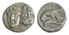 Ancient Coins - MOESIA, Istros. Circa 4th Century BC. AR 18mm Drachm (6,26gm). Facing male heads, the right inverted / Sea-eagle left, grasping dolphin with talons Toned Good Very Fine