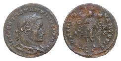 Ancient Coins - Constantine I the Great AD 306-337  Silvered Follis Æ 25mm 5,2g  Constantine I, as prince of the youth, standing front in military attire, holding two vexilla.Lungdunum Lion