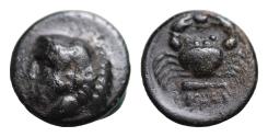 Ancient Coins - Caria, Kos. Ae, 1.8 g 13mm. Circa 4th - 3rd Century BC. Obv: Head of Herakles to left, wearing lion skin headdress Rev: Crab; shell above, club below. Very Fine/Rare!