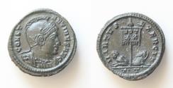 Ancient Coins - Constantine I (307/310-337). Æ Follis (19,5mm, 3g, ). Ticinum, 319-320. Helmeted and cuirassed bust r. R/ Two captives seated at base of standard inscribed VOT XX