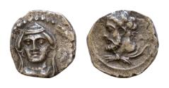 Ancient Coins - UNCERTAIN CILICIA. Possibly Tarsos. Datames. 378-372 B.C. AR obol. .0,6g. 9mm. Bust of the nymph Arethusa(?) facing slightly left / Bearded male head (Ares?)