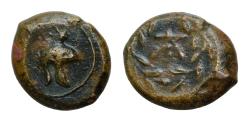 Ancient Coins - SICILY. Tauromenion. Campanian mercenaries, 354/3-344 BC. Onkia Bronze, 12 mm, 2,2g. Campanian helmet to right, ornamented with griffin. Monogram of TA within wreath.