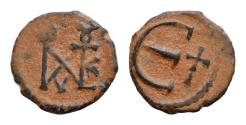 Ancient Coins - Justin II, AD 565-578. AE, Decanummium. 1.6g. 14 mm. Constantinople. Justin II monogram. Large Є, in field to right, cross.