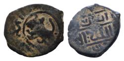 World Coins - ISLAMIC. Uncertain. AE24mm 3,5g  (Circa 11th-14th centuries). Obv: Lion left.