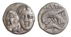Ancient Coins - MOESIA, Istros. Circa 4th Century BC. AR 18mm Drachm (6,23gm). Facing male heads, the right inverted / Sea-eagle left, grasping dolphin with talons Toned Good Very Fine