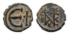Ancient Coins - Justin II, AD 565-578. AE, Decanummium. 1.6g. 14 mm. Constantinople. Justin II monogram. Large Є, in field to right, cross.