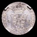 World Coins - Joseph Napoleon (1808-1814). 4 reales. 1810. Madrid. AI. (Cal-14). Ag. 5.94 g. Light toning and a large portion of original luster. Encapsulated by NCV as MS 63. Very scarce in this con...