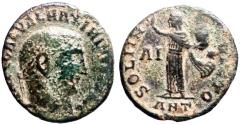Ancient Coins - Maximinus II AE19 Follis. Sol holds head of Sarapis