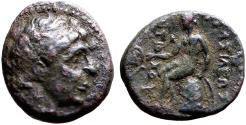 Ancient Coins - Seleukid Kings. Antiochus I AE15 Apollo seated on omphalos testing arrow