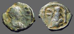Ancient Coins - Justin I AE12 Pentanummium.  Tyche of Antioch in temple, River God below. 