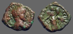 Ancient Coins - Caracalla AE18 Tyche w. rudder & cornucopia.  Caesarea