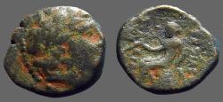 Ancient Coins - Antiochos III AE13 Apollo seated on omphalos, w. arrow 