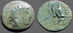Ancient Coins - Seleukid, Tryphon AE18 His Diad. Head rt / Ibex Helmet