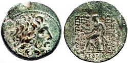 Ancient Coins - Seleukid Kings. Demetrios II AE24 Zeus / Apollo seated on omphalos
