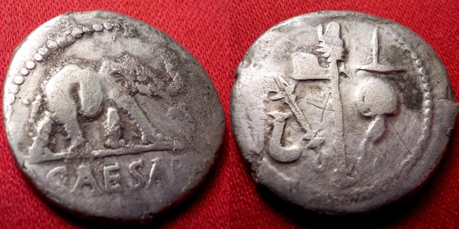 JULIUS CAESAR AR silver denarius. Elephant trampling serpent. Four