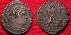 Ancient Coins - CONSTANTINE I THE GREAT AE3. SARMATIA DEVICTA, Victory advancing, beside captive. Struck at Trier