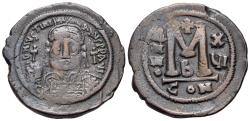 Ancient Coins - Justinian I (527-565). Æ Follis. Helmeted and cuirassed bust. R/Large M, ANNO - X/VI; cross, below CON - B.
