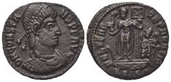Ancient Coins - Constans (337-350). Æ 18mm. Siscia, 348-350. R/ Emperor standing on galley