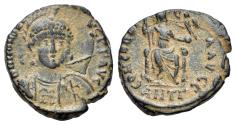 Ancient Coins - Honorius (393-423). Æ 18mm. Antioch. R/ Roma seated facing