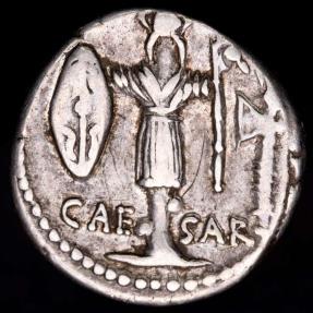 Julius Caesar. AR Denarius (47-48 BC) CAESAR. Gallic Trophy, Holding ...